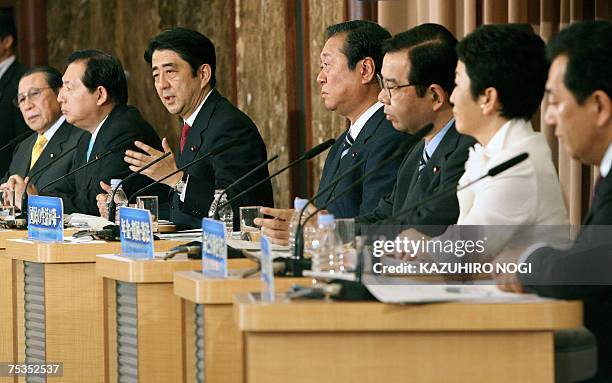 Japan's Prime Minister and ruling Liberal Democratic Party President Shinzo Abe speaks while other party leaders listen during their debate for the...