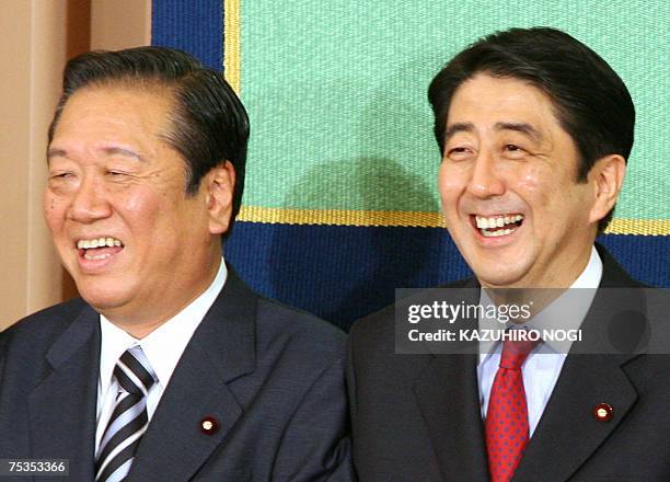 Japan's Prime Minister and ruling Liberal Democratic Party President Shinzo Abe and main opposition Democratic Party of Japan President Ichiro Ozawa...