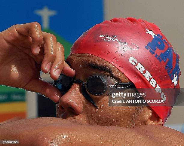 Rio de Janeiro, BRAZIL: Panama's swimmer Edgar Crespo rests after a practice for the Pan-American Games at the Maria Lenk Aquatic Center in Rio de...