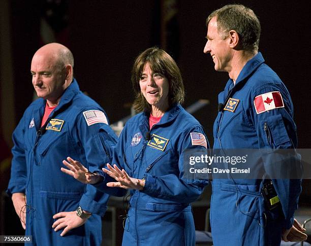 Astronaut-educator Barbara Morgan comments as she stands between Endeavour commander Scott Kelly and mission specialist Dave Williams, of Canada...