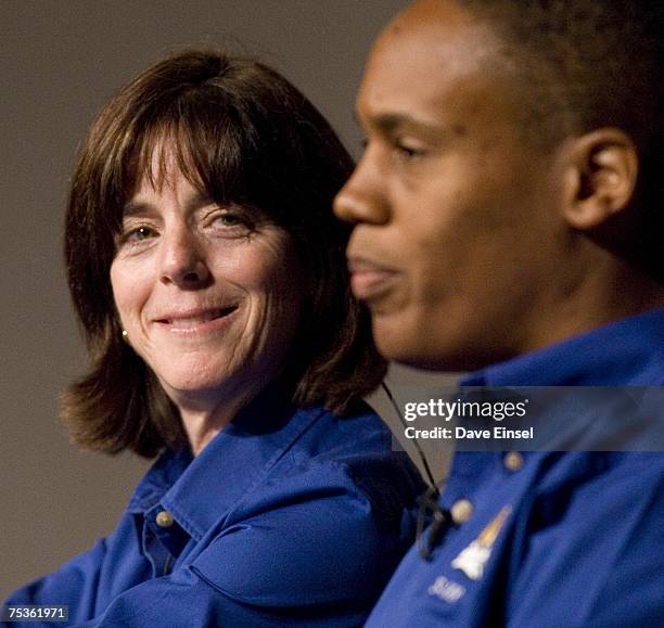 Astronaut-educator Barbara Morgan looks on as mission specialist Alvin Drew comments during an Endeavour crew briefing July 11, 2007 at Johnson Space...