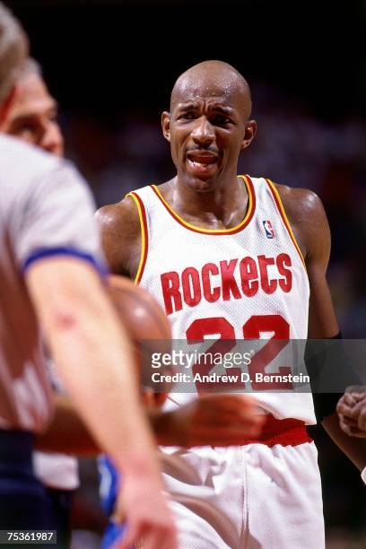 Clyde Drexler of the Houston Rockets chats with an official during Game Three of the 1995 NBA Finals against the Orlando Magic at the Summit on June...