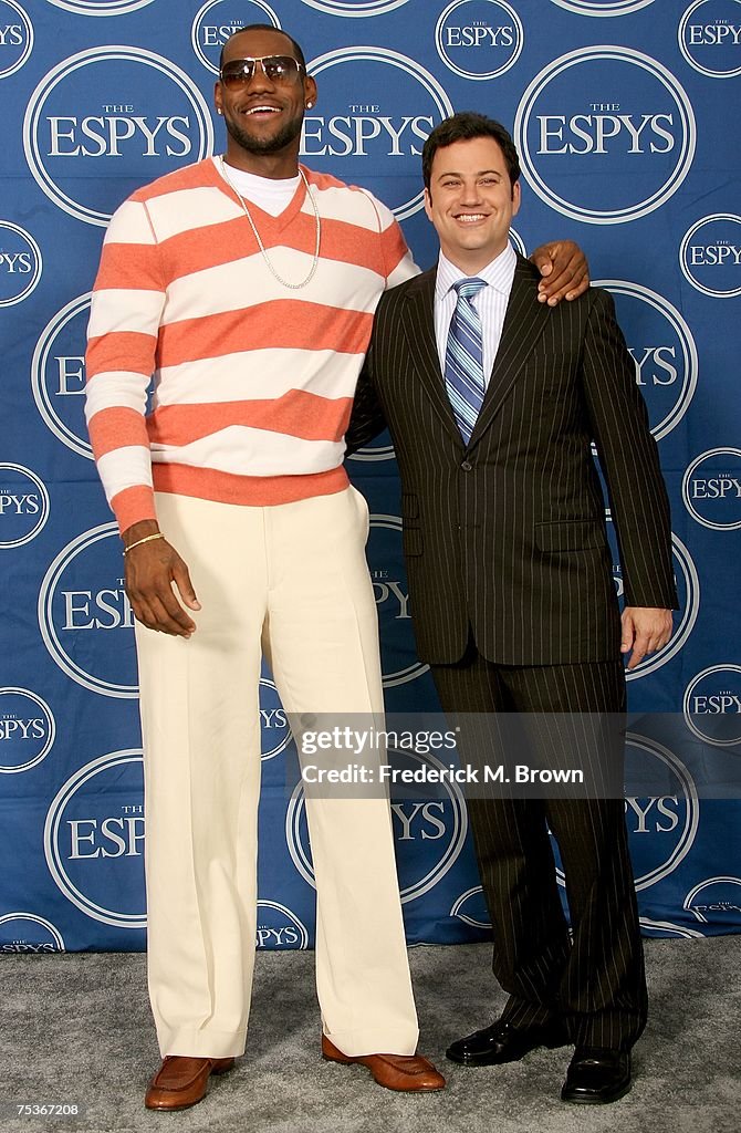 Co-host LeBron James and Jimmy Kimmel pose for photos in the press