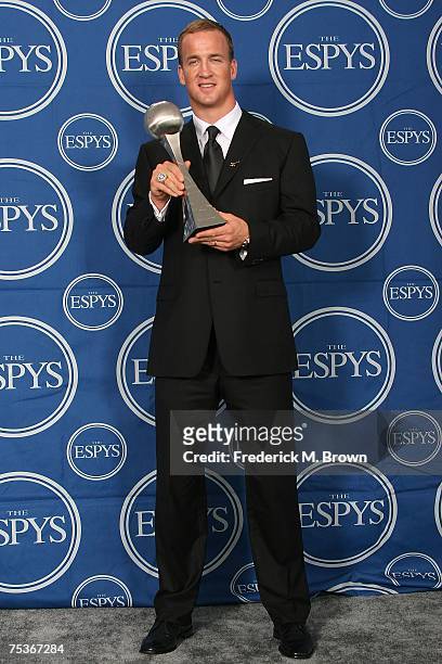 Player Peyton Manning poses for photos in the press room after winning the award for "Best Championship Performance" during the 2007 ESPY Awards at...