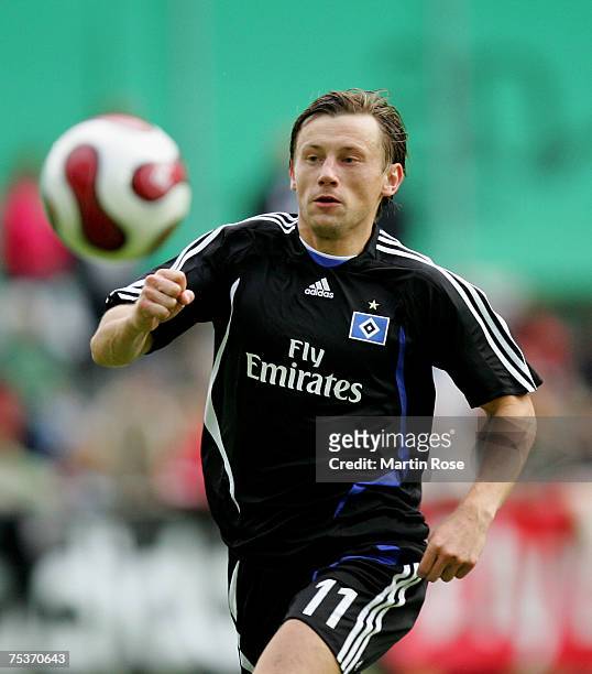Ivica Olic of Hamburg runs with the ball during the friendly match between Grochlin Grodzisk and Hamburger SV at Sportzentrum Laengenfeld on July 11,...