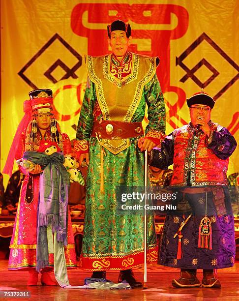 The world's tallest man Bao Xishun with his bride Xia Shujuan get married in traditional Mongolian wedding ceremony at the Genghis Khan Mausoleum...