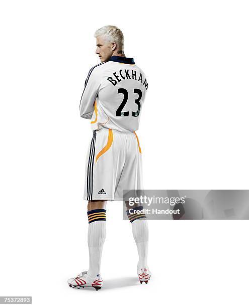 In this handout photo provided by Adidas, LA Galaxy star signing David Beckham poses wearing his new Galaxy strip on July 11, 2007 in Carson,...