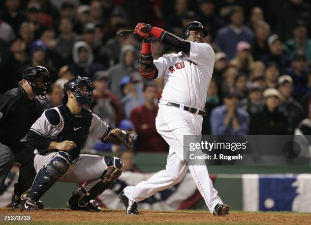 Boston Red Sox batter David Ortiz connects for a two-run home run in the 12th inning against the New York Yankees in Game Four of the American League...