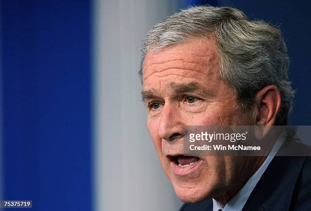 President George W. Bush answers a question about the war in Iraq during a press conference July 12, 2007 at the White House in Washington, DC. Bush...