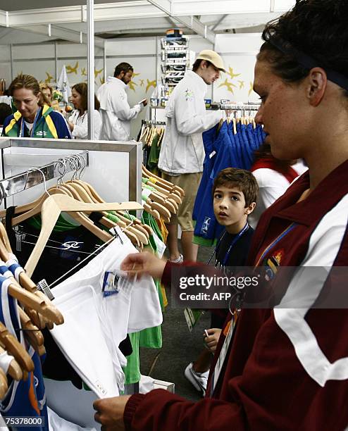 Rio de Janeiro, BRAZIL: Venezuela's swimmer, Erin Volcan, looks at short at the gift shop of the Panamerican Villa a day before start the Panamerican...