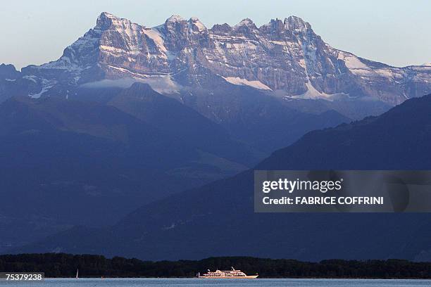 Montreux, SWITZERLAND: A ship sails on the Lake Geneva under the Dents du Midi, a 3257-metre-height mountain range, located in western Switzerland on...