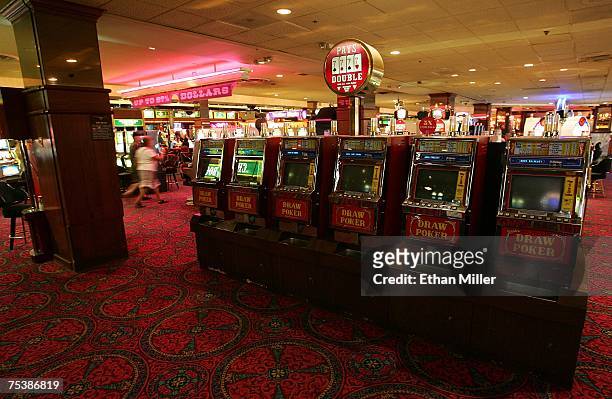 Patrons walk by out-of-service video poker machines at the New Frontier Hotel & Casino July 12, 2007 in Las Vegas, Nevada. The 984-room property, in...
