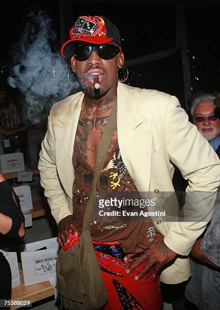 Former NBA player Dennis Rodman attends the True Religion swimwear fashion show during "Mercedes Benz Fashion Week: Miami Swim" in the Oasis tent at...