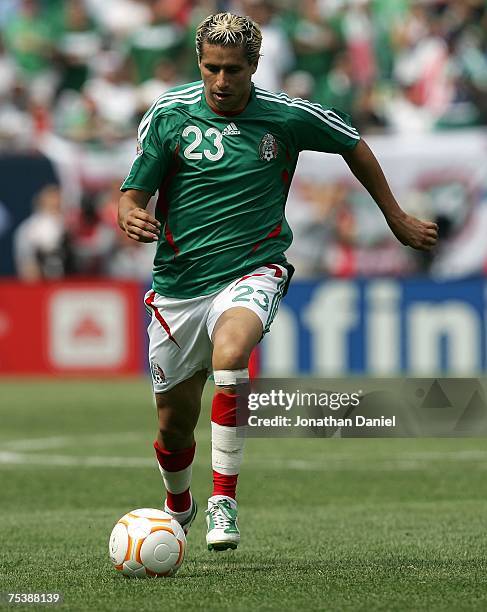 Adolfo Bautista of Mexico moves the ball against the USA during the CONCACAF Gold Cup Final match at Soldier Field on June 24, 2007 in Chicago,...