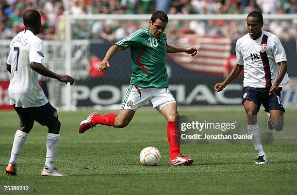 Cuauhtemoc Blanco of Mexico moves the ball against the USA during the CONCACAF Gold Cup Final match at Soldier Field on June 24, 2007 in Chicago,...
