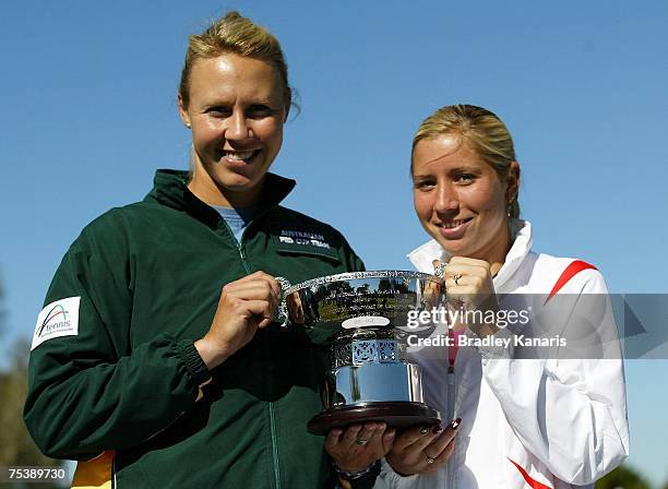 Alicia Molik of Australia and Alona Bondarenko of Ukraine pose with the trophy before the Fed Cup 2007 World Group II Playoff between Australia and...