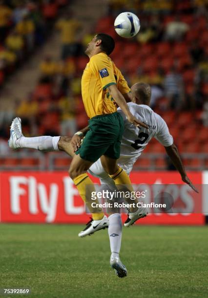John Aloisi of Australia challenges Jasim Al Hamd of Iraq during the AFC Asian Cup 2007 group A match between Iraq and Australia at the Rajamangala...