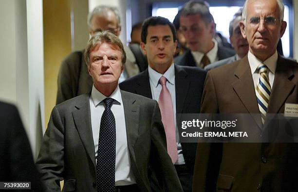 French Foreign Minister Bernard Kouchner arrives with unidentified officials to a meeting with Kosovo's Prime Minister Agim Ceku , 13 July 2007, in...