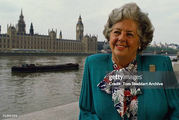The Right Honourable Betty Boothroyd MP, poses in front of the Houses of Parliament in London, April 1992.