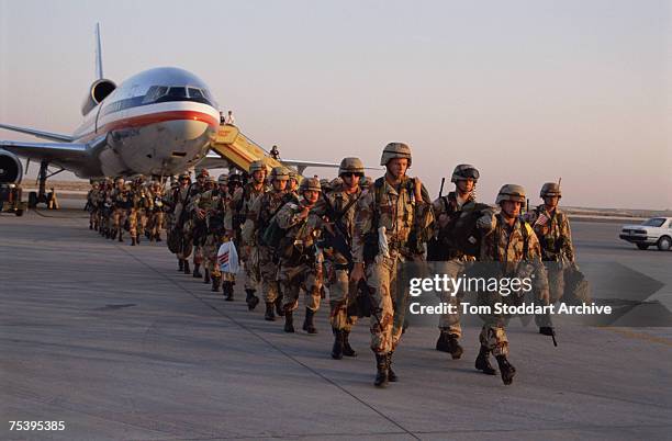 Troops arrive in Saudi Arabia to take part in Operation Desert Shield during the Gulf War, 1990.