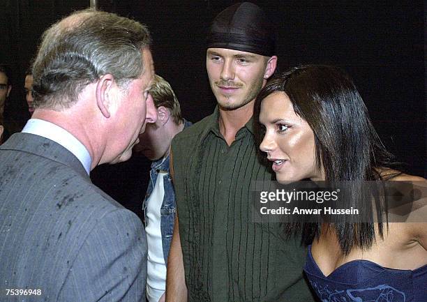 The Prince of Wales, right meets pop star Victoria Beckham and her footballing husband David Beckham at the Princes Trust Capital FM Party in the...