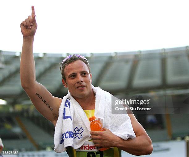 South African runner Oscar Pistorius celebrates after winning the Mens 400m 'B' race during the IAAF Golden Gala at The Olympic Stadium on July 13,...
