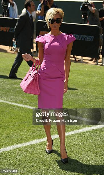 Victoria Beckham poses at the Home Depot Center Stadium where her husband David Beckham was officially announced as a LA Galaxy Player on July...