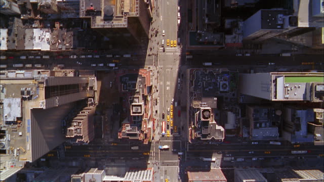 Overhead aerial Manhattan building rooftops and street traffic