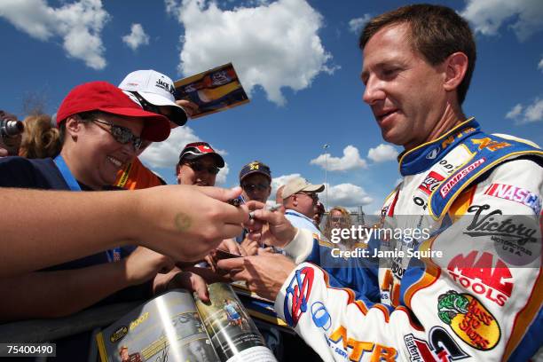 John Andretti, driver of the National Tire & Battery Dodge, signs autographs for fans during qualifying for the NASCAR Nextel Cup Series USG...