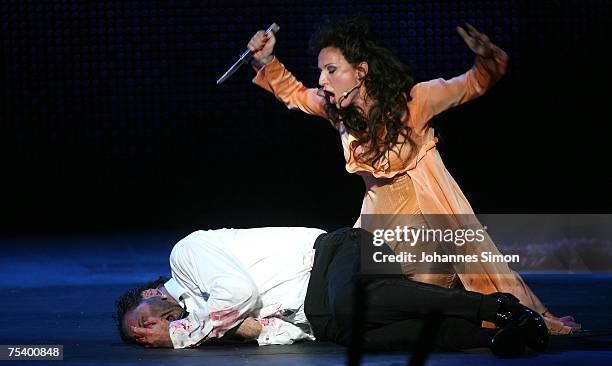 German singer Nadja Michael as "Tosca" and Israeli singer Gison Saks as "Baron Scarpia" perform on the floating stage during the rehearsal of the...