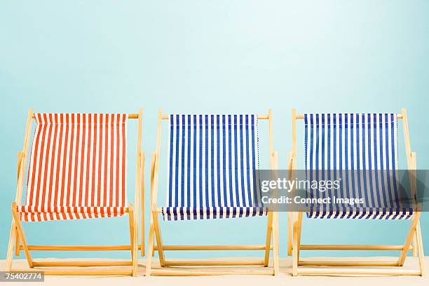 three deckchairs - deckchair stock pictures, royalty-free photos & images