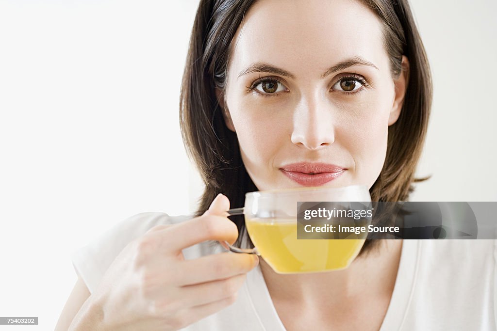 Woman drinking green tea