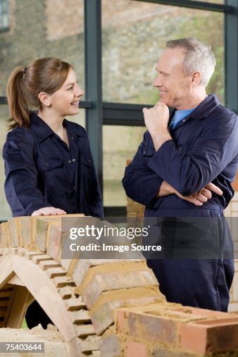 Bricklayer and apprentice Bricklayer and apprentice