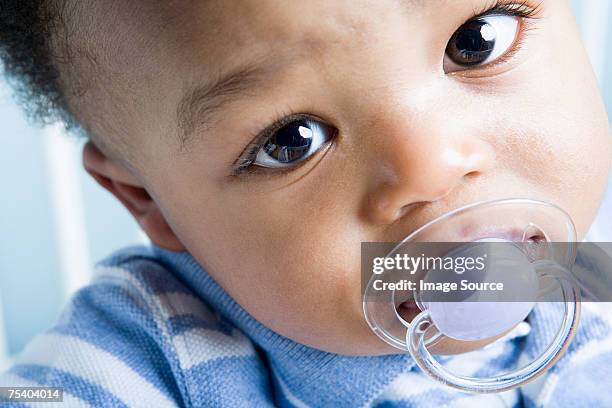 portrait of baby boy - pacifier stockfoto's en -beelden