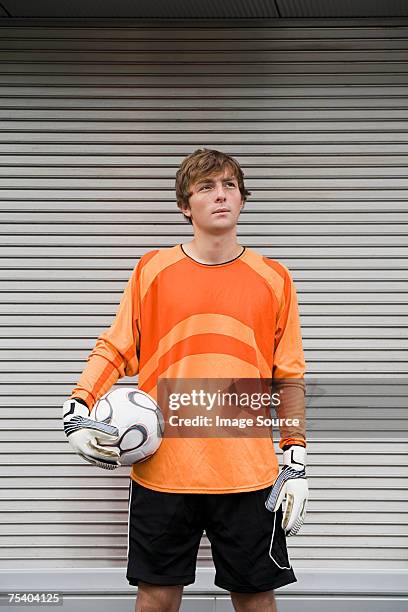 young goalkeeper - teen boy shorts stock pictures, royalty-free photos & images