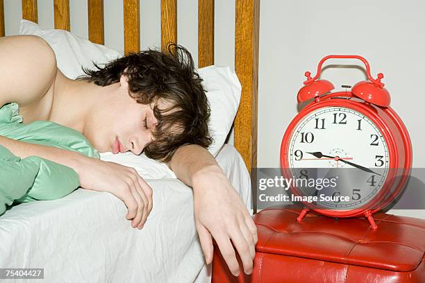 teenage boy sleeping - lazy stockfoto's en -beelden