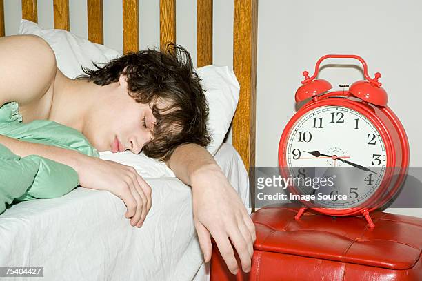 teenage boy sleeping - teen sleeping bedroom stock pictures, royalty-free photos & images