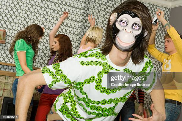people dancing at a house party - female monkey costume stock pictures, royalty-free photos & images
