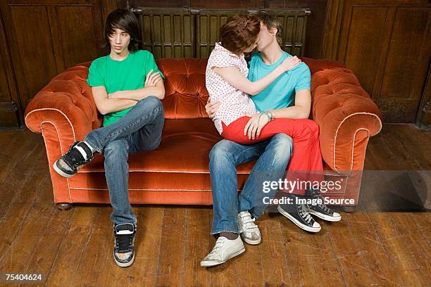 jealous teenager with kissing couple - exclusion stock pictures, royalty-free photos & images