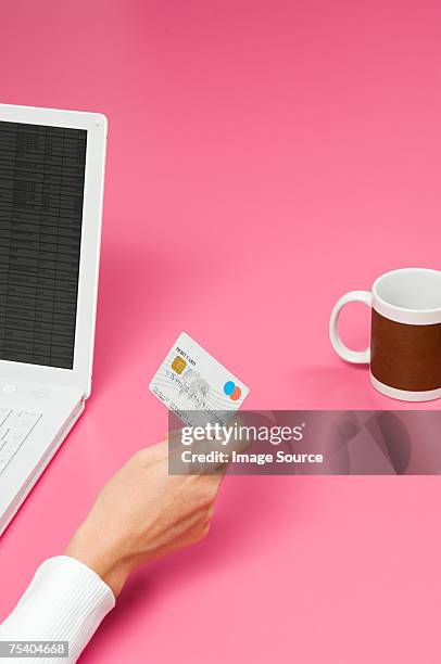 person internet banking - hand holding credit card stock pictures, royalty-free photos & images