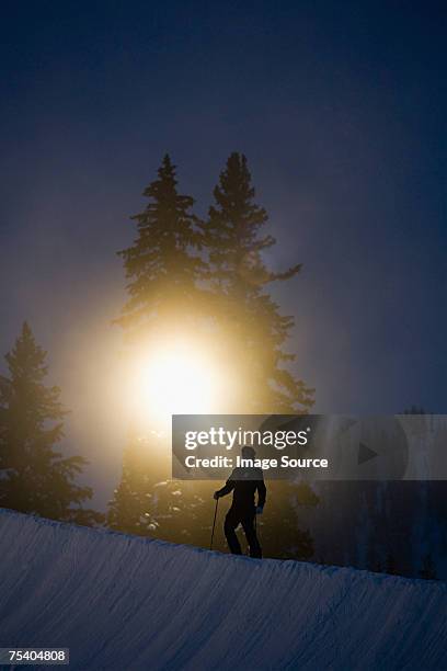 skier at night - night skiing stock pictures, royalty-free photos & images