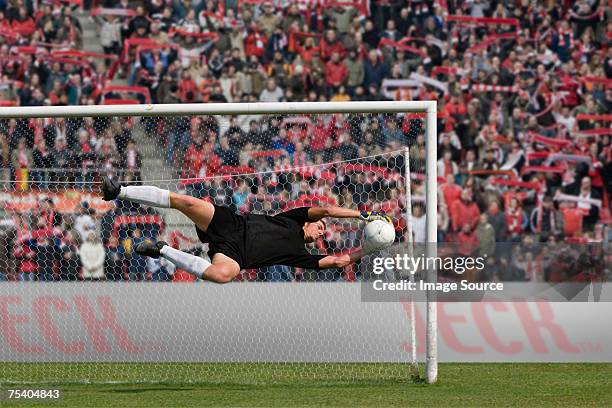 goalkeeper making a save - redding sporten stockfoto's en -beelden