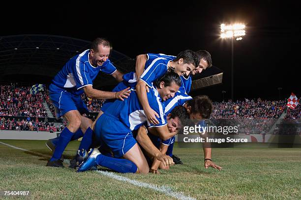 football team celebrating - soccer team stock pictures, royalty-free photos & images