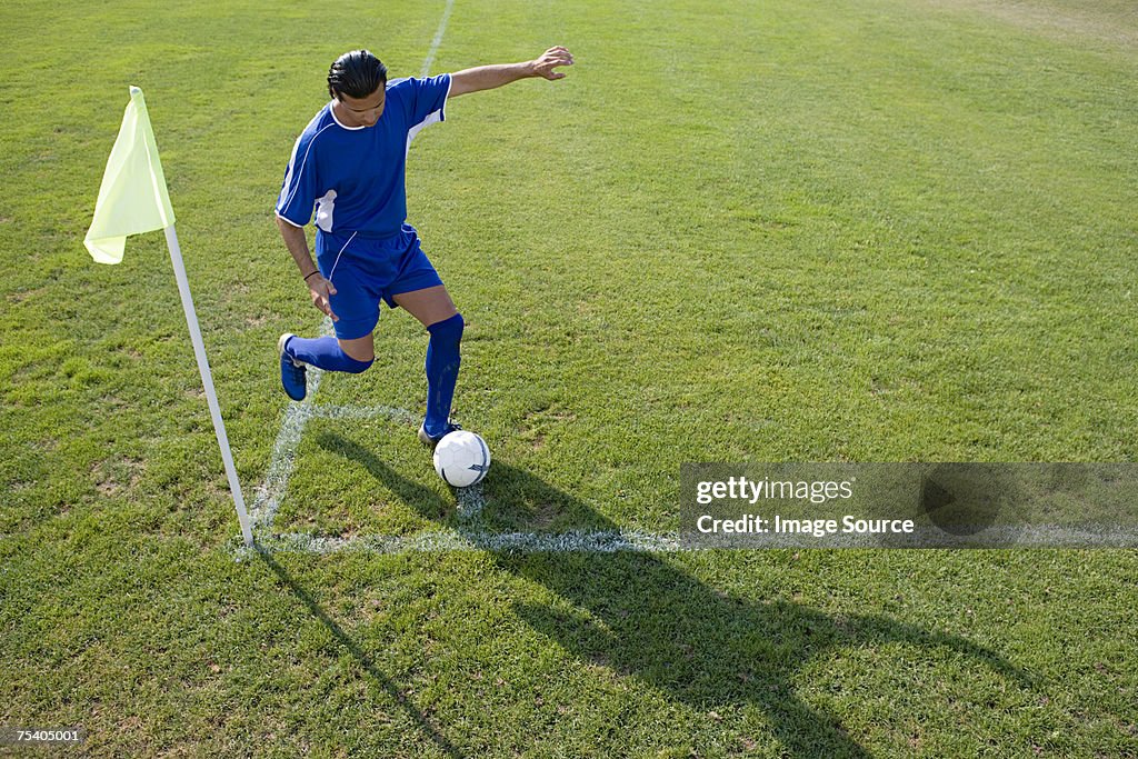 Footballer taking a corner kick