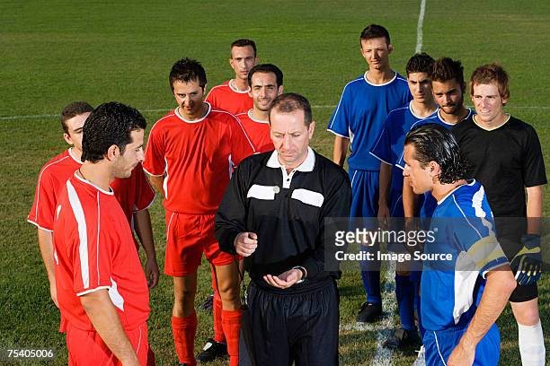 referee tossing coin - flipping a coin stock pictures, royalty-free photos & images