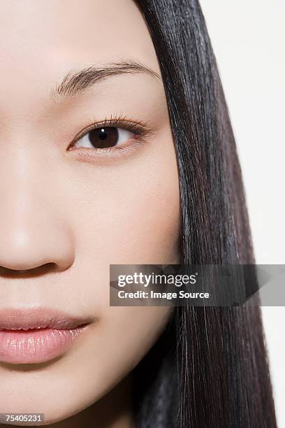 nahaufnahme des weiblichen gesicht - asian woman model stock-fotos und bilder