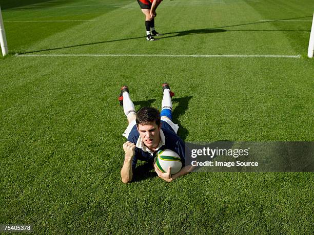 rugby player scoring a try - try scoring stock pictures, royalty-free photos & images