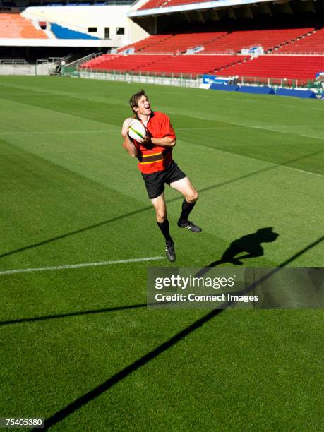 Leaping Trys Rugby 77 Rugby Player Leaping Up To Catch Ball Stock Photos, High-Res ...