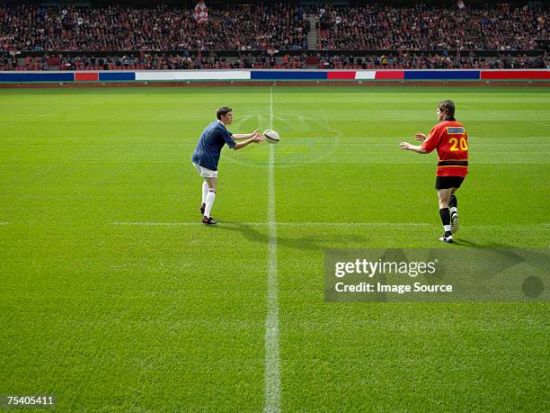 rugby player throwing ball - rugby game stock pictures, royalty-free photos & images