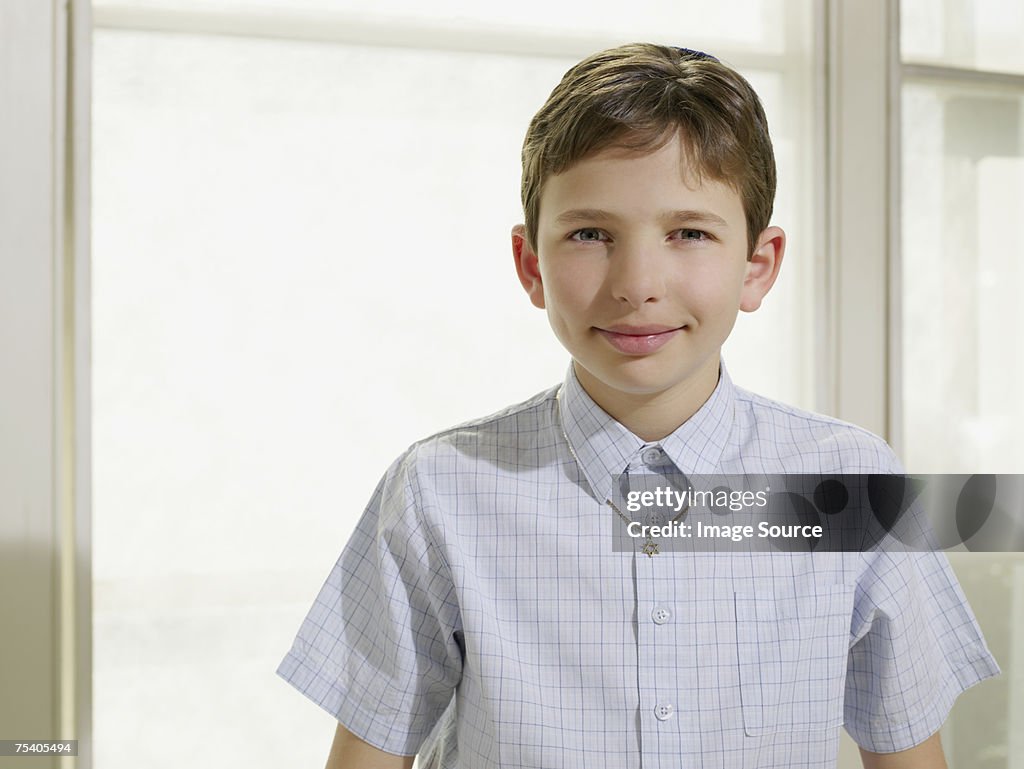Jewish boy wearing a star of david necklace